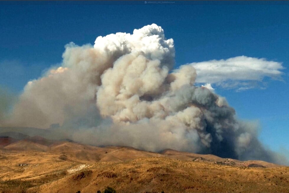 This image taken from video shows plumes of smoke rising from active wildfires Saturday, Aug. 22, 2026, in Reno, Nevada
