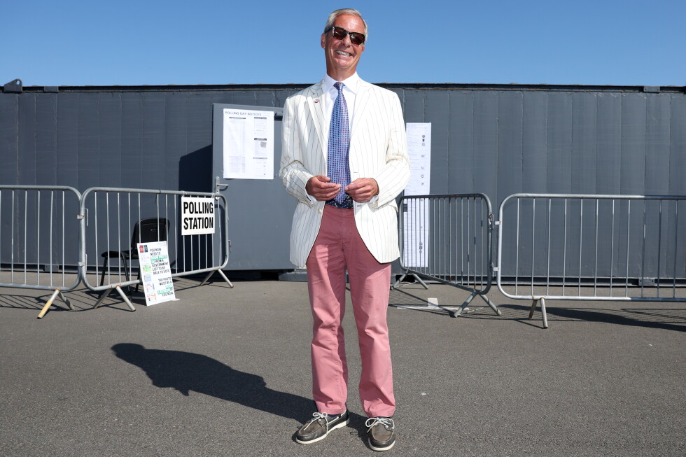 Britain's Reform UK party leader Nigel Farage arrives at a polling station in Walton on the Naze, Thursday, Aug. 13, 2026 to