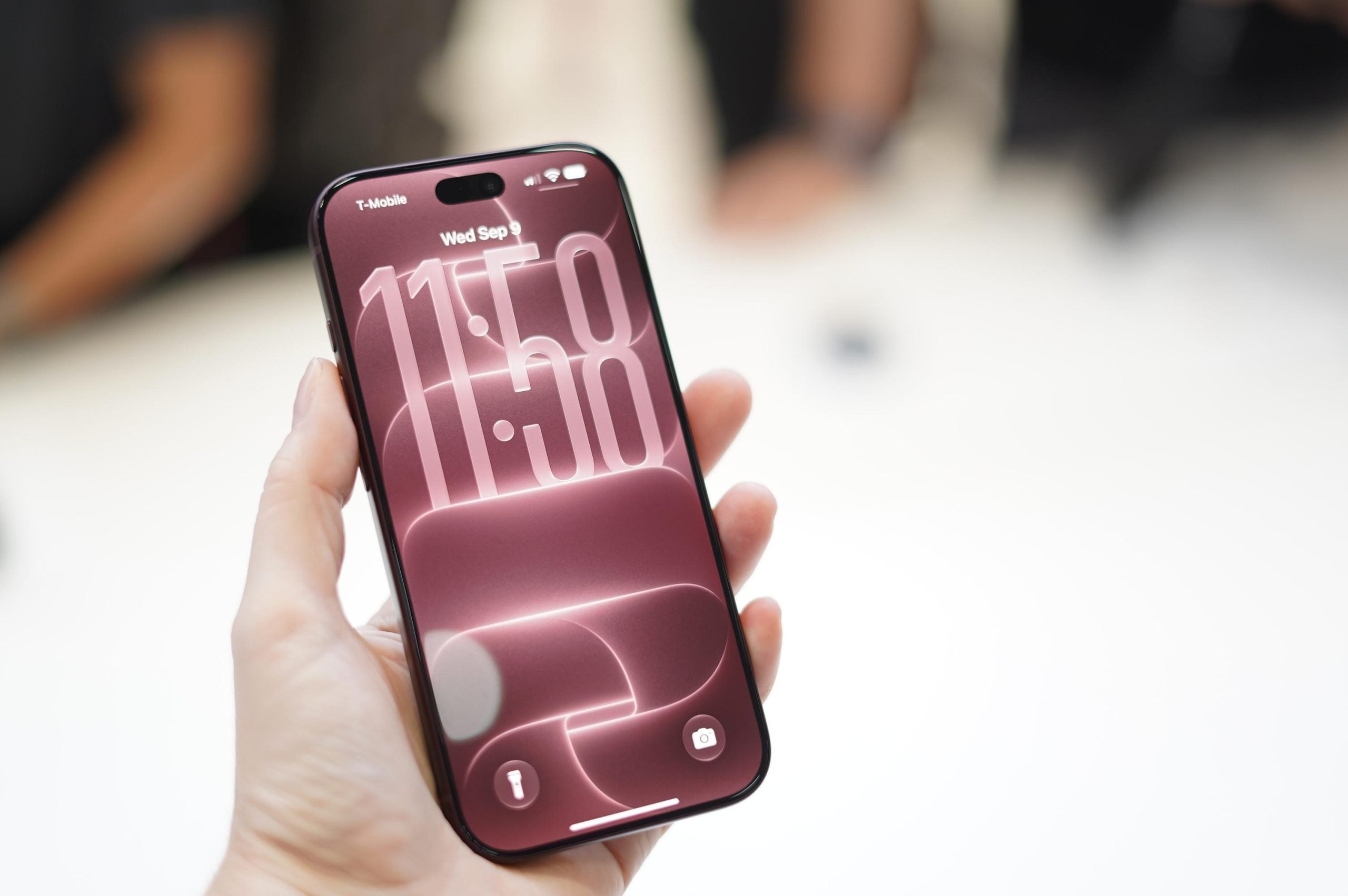 A person holding an iPhone 18 Pro phone